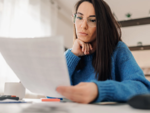 Image of a woman reviewing a document