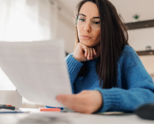 Image of a woman reviewing a document